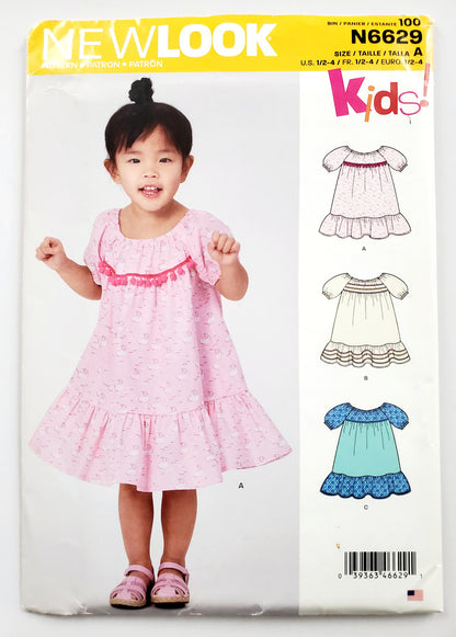 NEW LOOK Sewing Pattern N6629 Kids Girls Toddler Dress with Cute Pom Pom Trim & Ruffles. Size 1/2 - 4