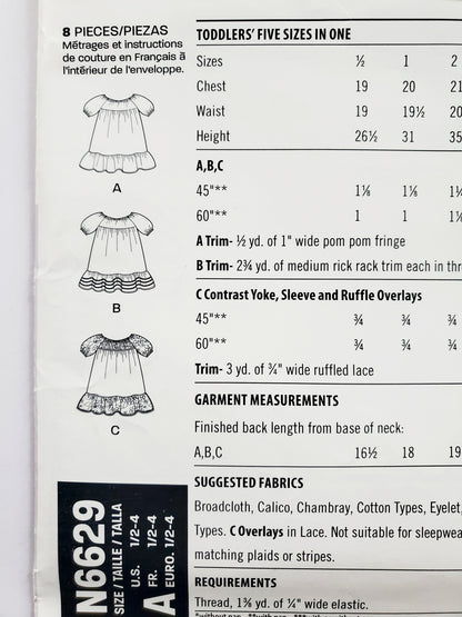 NEW LOOK Sewing Pattern N6629 Kids Girls Toddler Dress with Cute Pom Pom Trim & Ruffles. Size 1/2 - 4