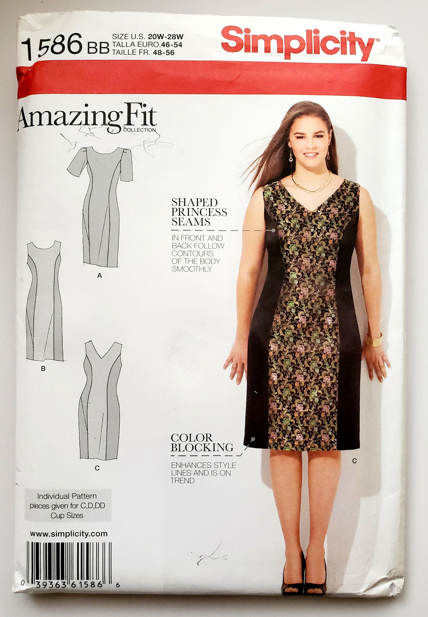Simplicity Sewing Pattern 1586 Sizes 20-28 model wearing an 'Amazing Fit' dress with princess seams and colour block. 